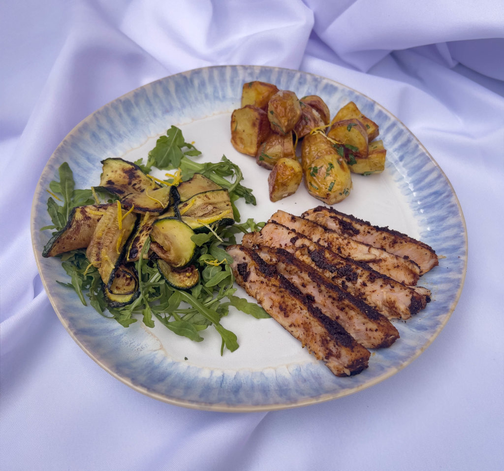 Adobo & coffee crusted tuna steak, with a warm, citrusy roast potato salad, and grilled courgette salad